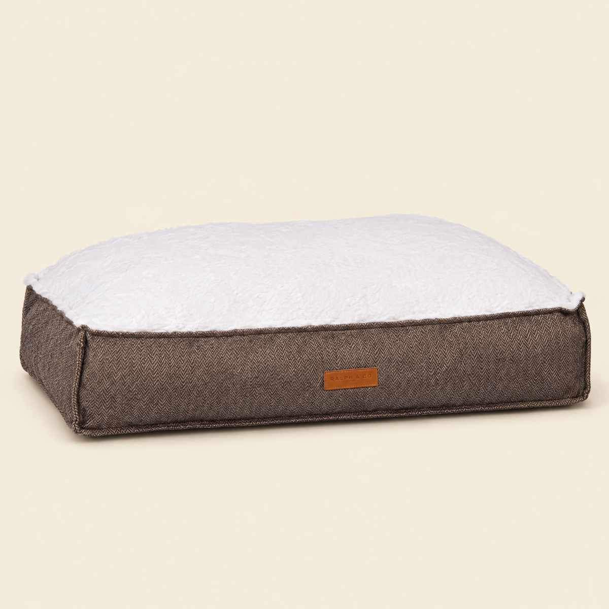 The Lincoln Tweed Flat Pillow Bed by Ralph & Co, packshot on cream