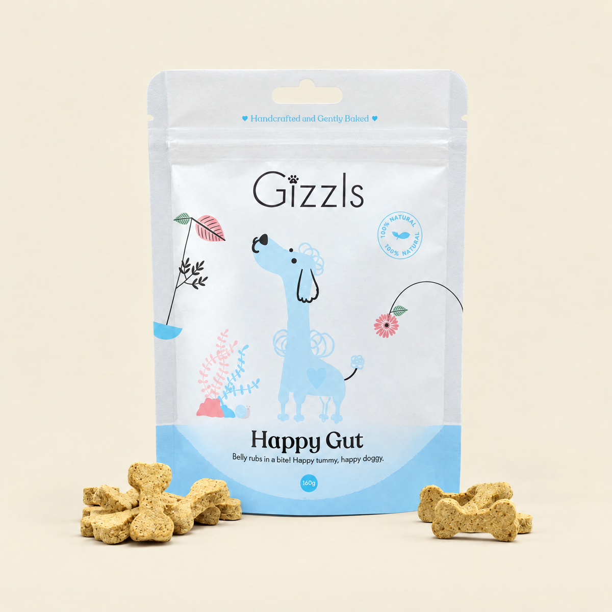 Gizzls Happy Gut Small Dog Treats pack with treats on cream