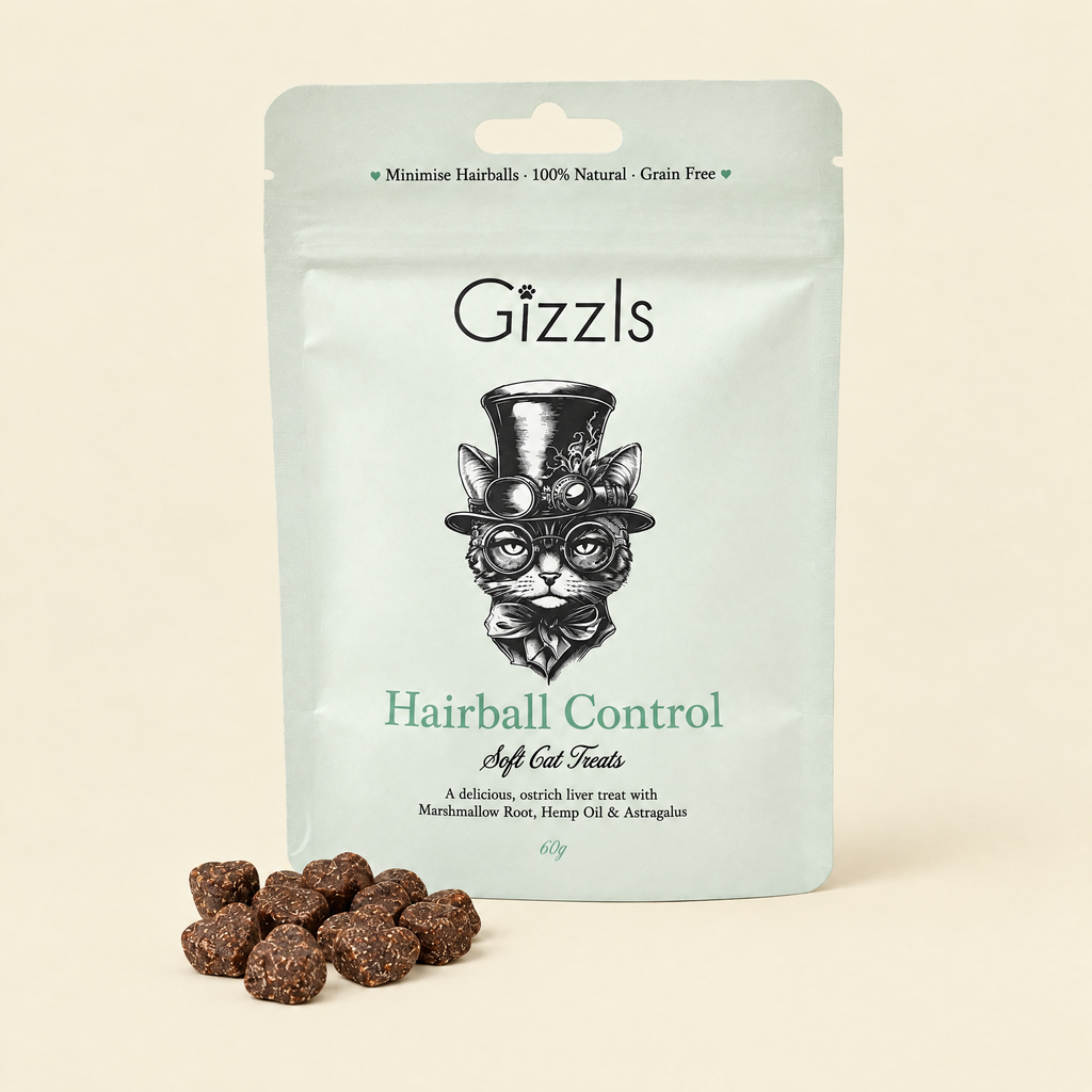 Gizzls Hairball Control Soft Cat Treats pack with treats on cream