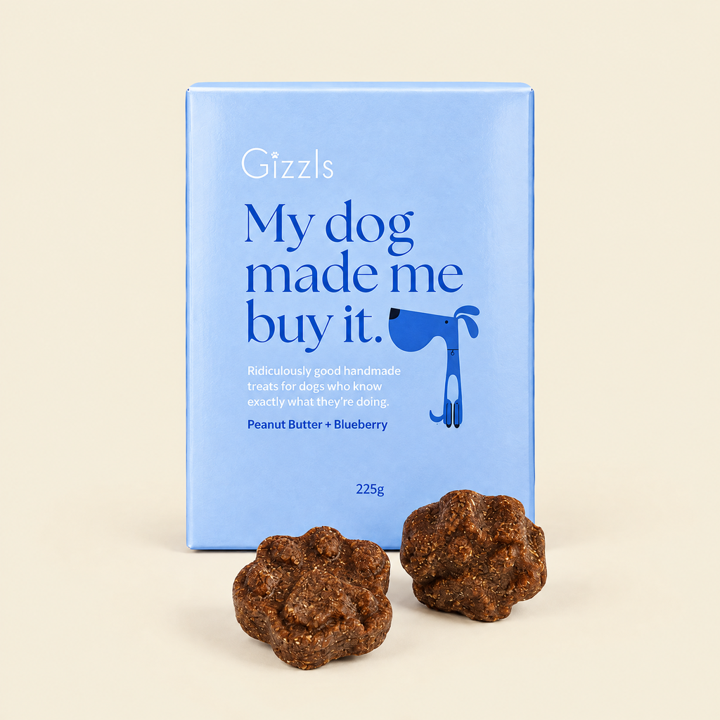 Gizzls My Dog Made Me Buy It Peanut Butter & Blueberry pack with treats on cream