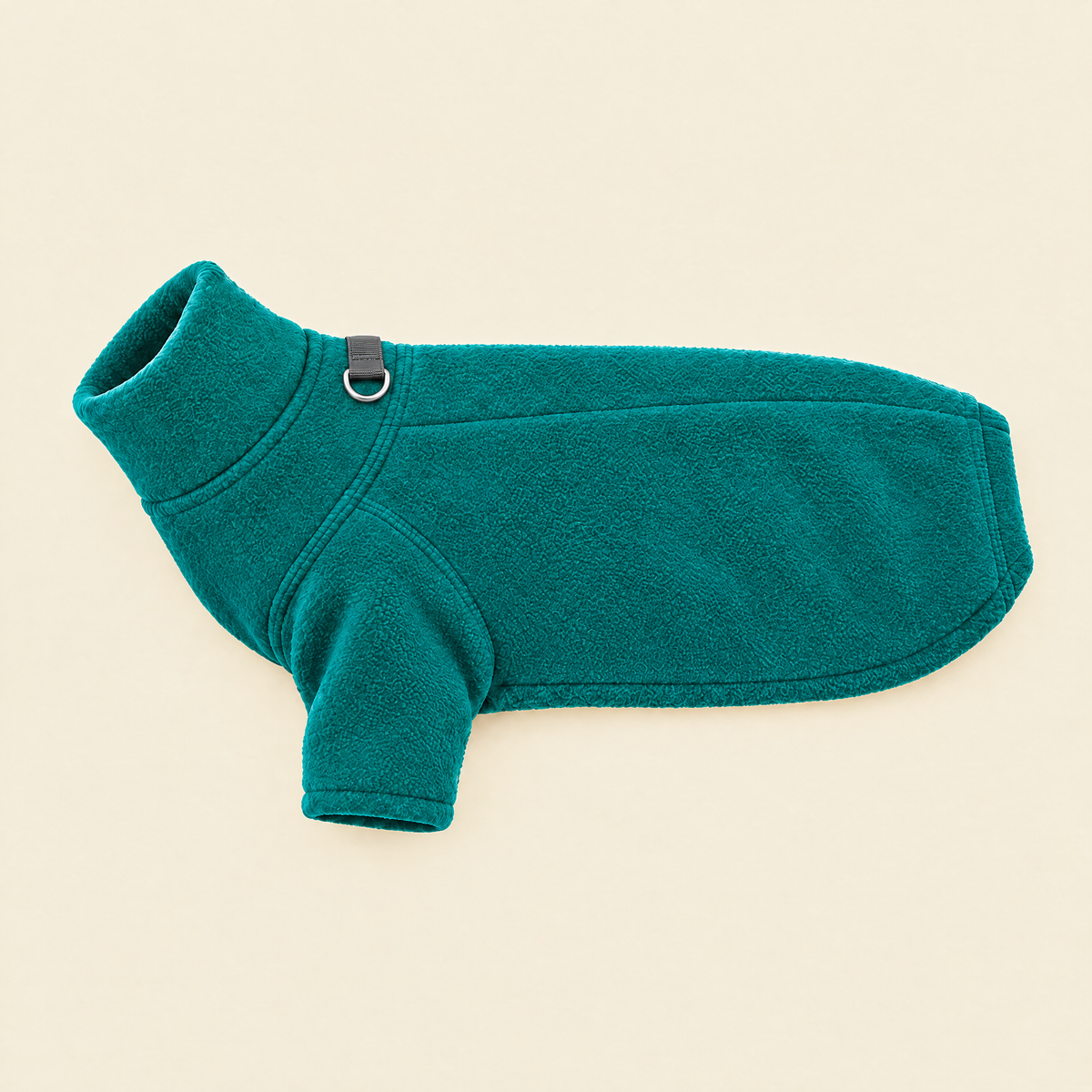Green Fleece Dog Coat laid flat on cream, showing the lead ring