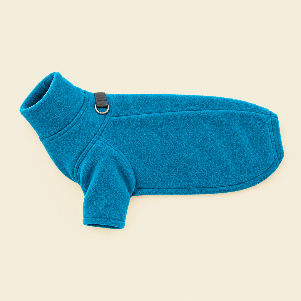 Blue Fleece Dog Coat laid flat on cream, showing the lead ring