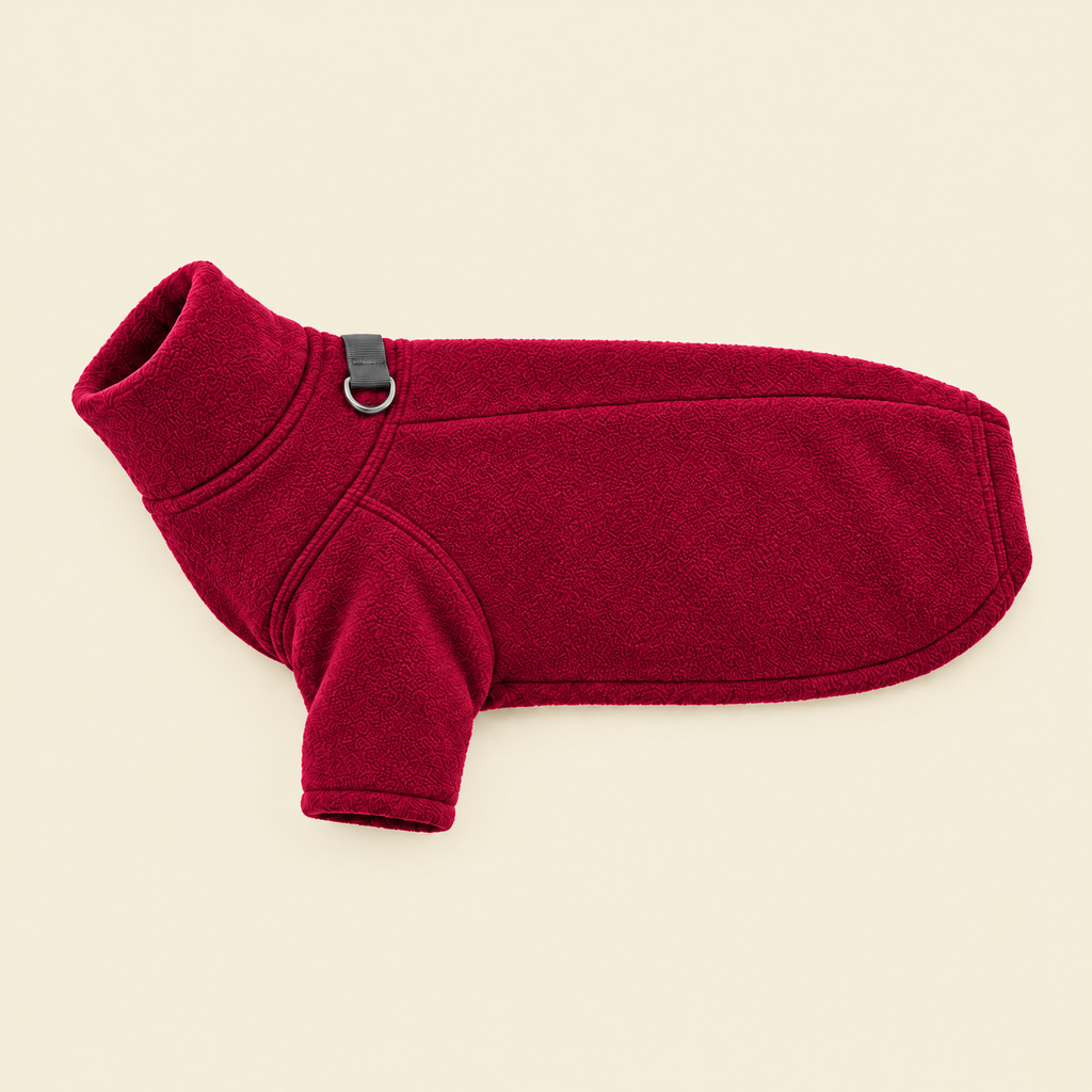 Berry Red Fleece Dog Coat laid flat on cream, showing the lead ring
