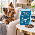 Yorkshire Terrier gazing at a pack of Buffalo Lung Bites by The Buffalo Co.