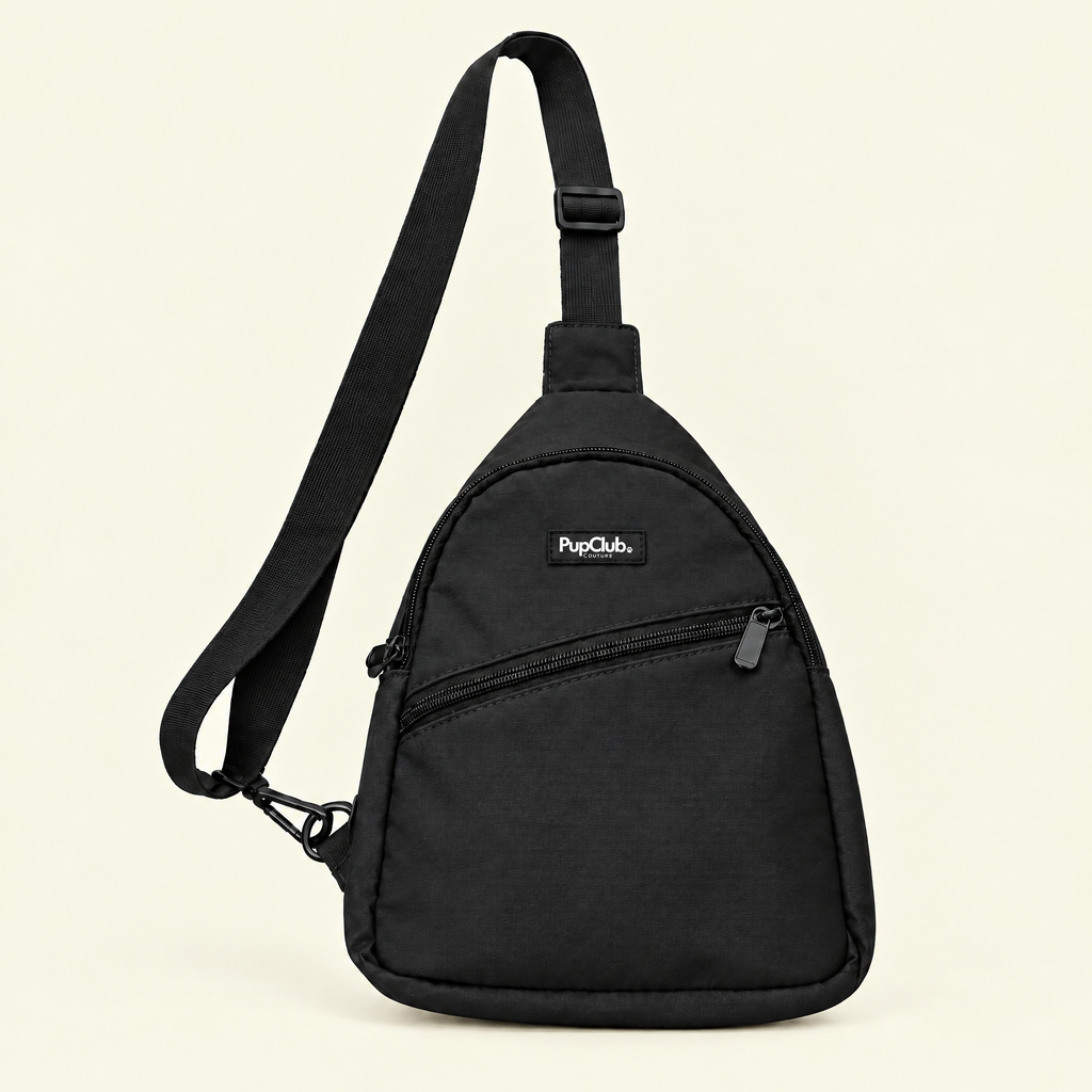 Black dog walking sling bag on a plain cream background