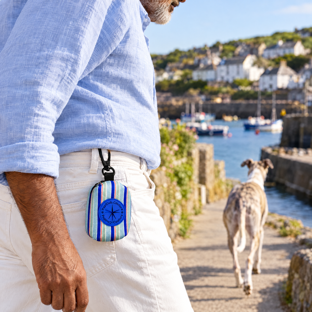 Sea Breeze Stripes poo bag holder clipped to a belt on a dog walk