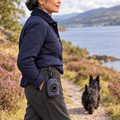 Tweed Blue poo bag holder clipped to a belt on a dog walk