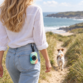 Pastel Waves poo bag holder clipped to a belt on a dog walk