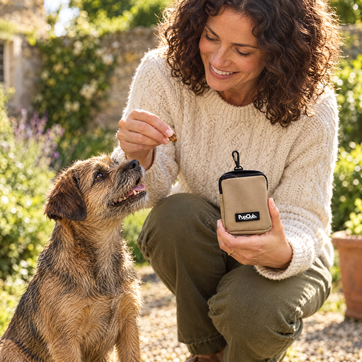 Tan treat pouch by PupClub Couture at treat time with a happy dog