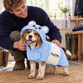 Puppy being dried in the Blue teddy bear drying robe by PupClub Couture