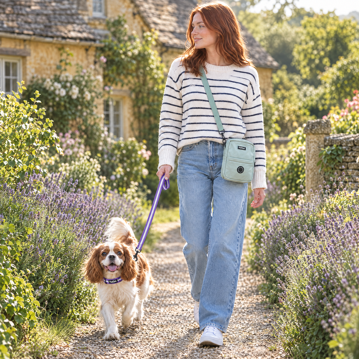 Dog walker wearing the Sage Green mini dog walking bag by PupClub Couture