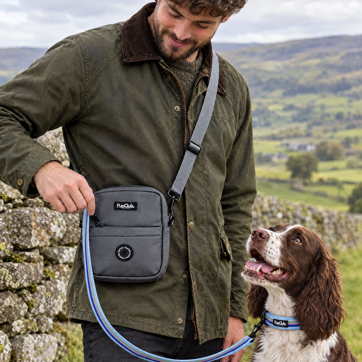 Close-up of the Grey mini dog walking bag by PupClub Couture worn at the hip