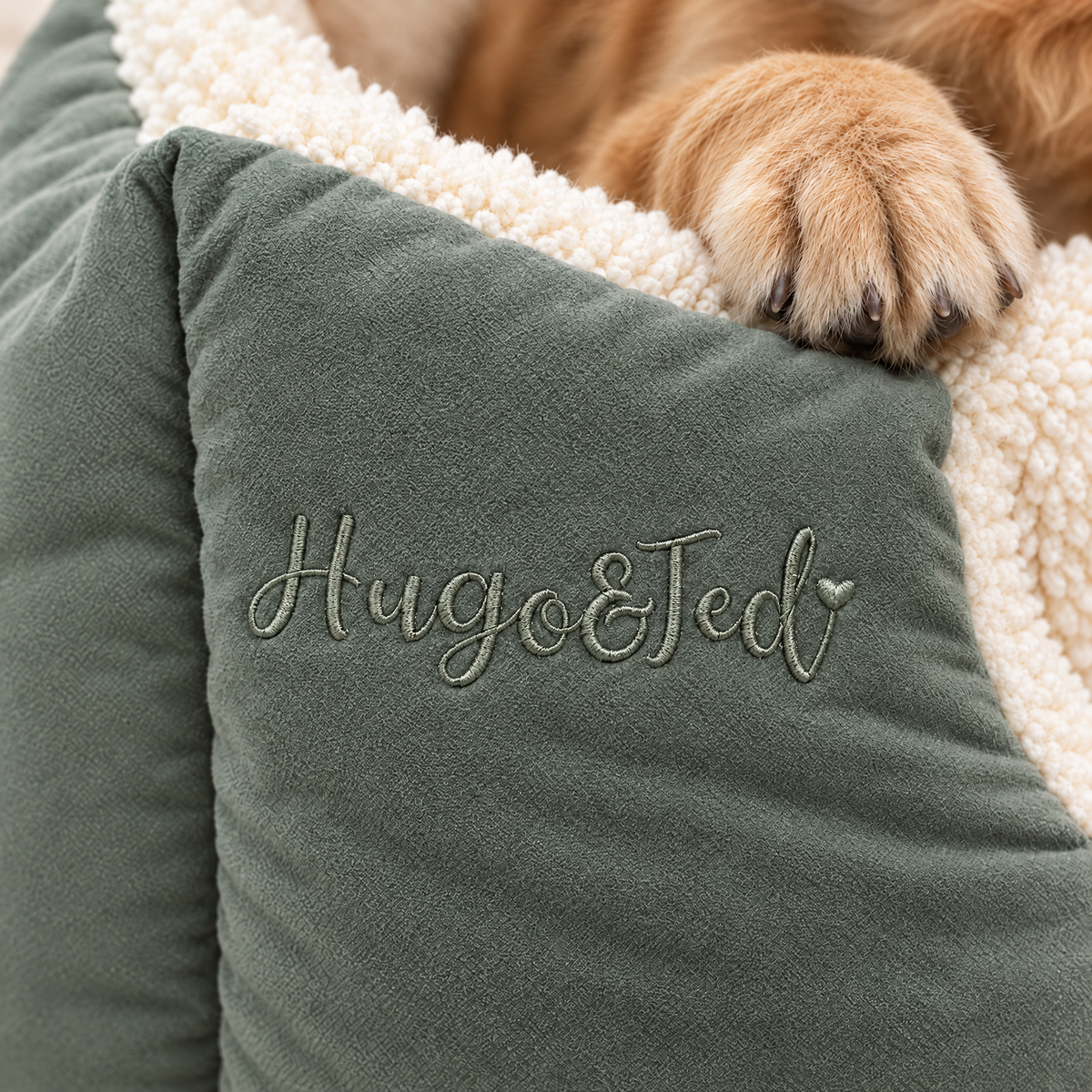 Embroidered Hugo & Ted logo on the sage Rainfleece Fortress Bed